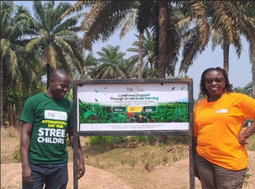 Justina and Abu at a village project